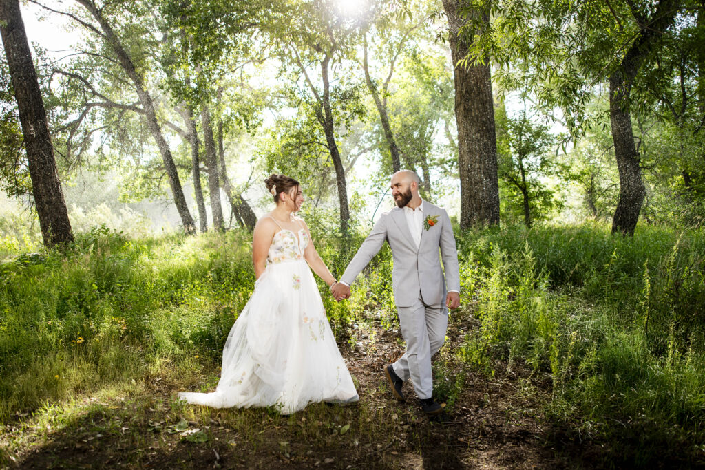 Rain behind bride and groom at nerdy winery loveland colorado wedding Colorado Wedding Photographer Colorado Wedding Photographer